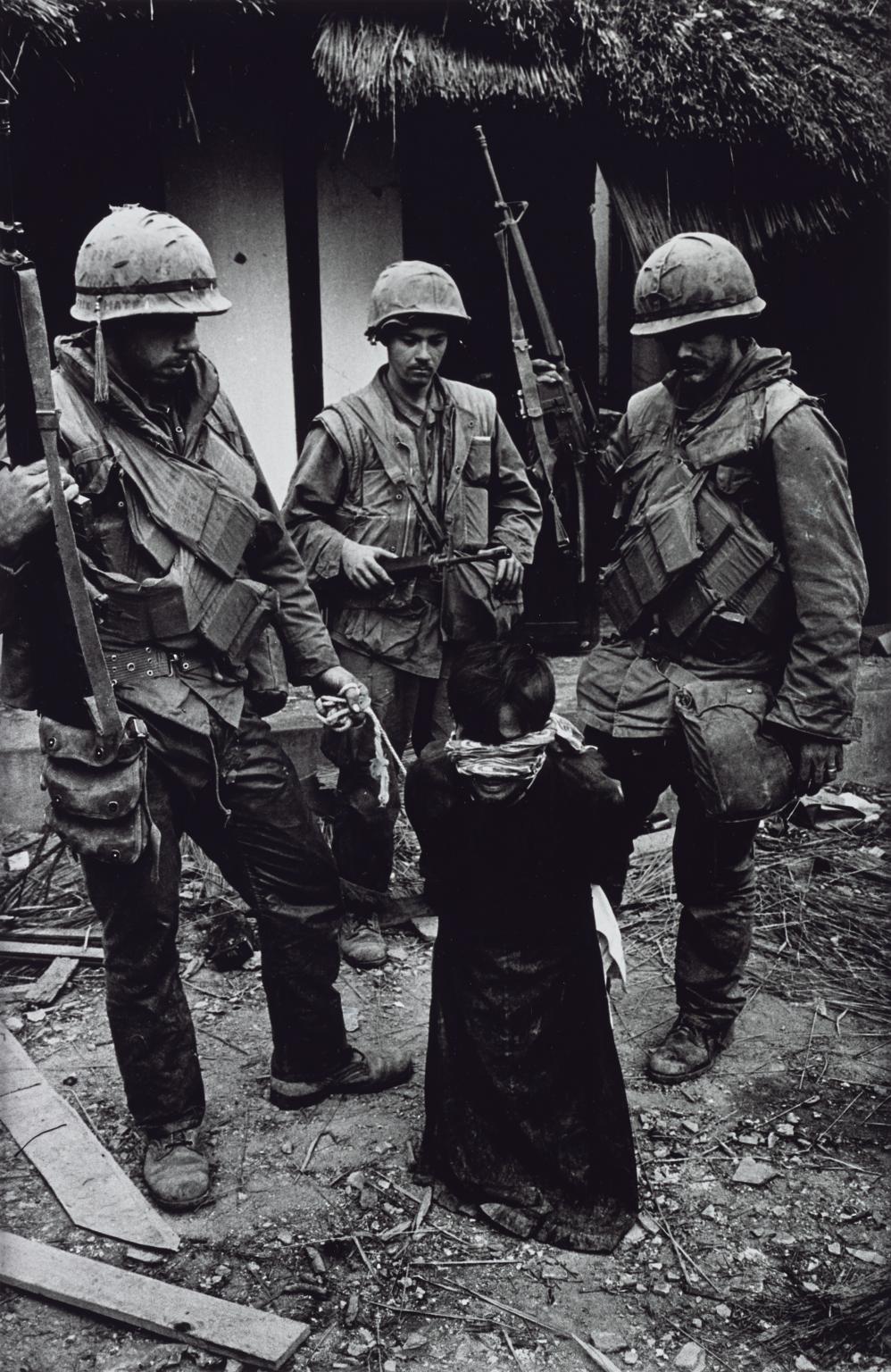 US Marines Tormenting an Old Vietnamese Civilian, The Battle for the City of Hue 1968, printed 2013 by Don McCullin born 1935